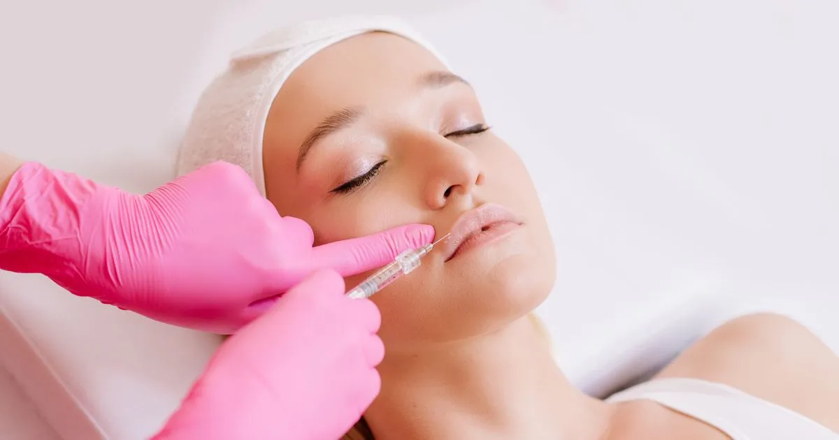 Dermal Filler injection into a woman's lips by a professional in Cary, NC