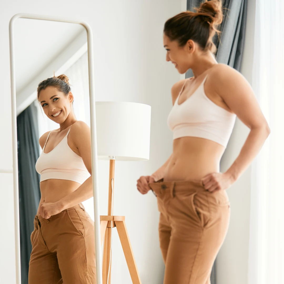 A woman sees their wellness in the mirror